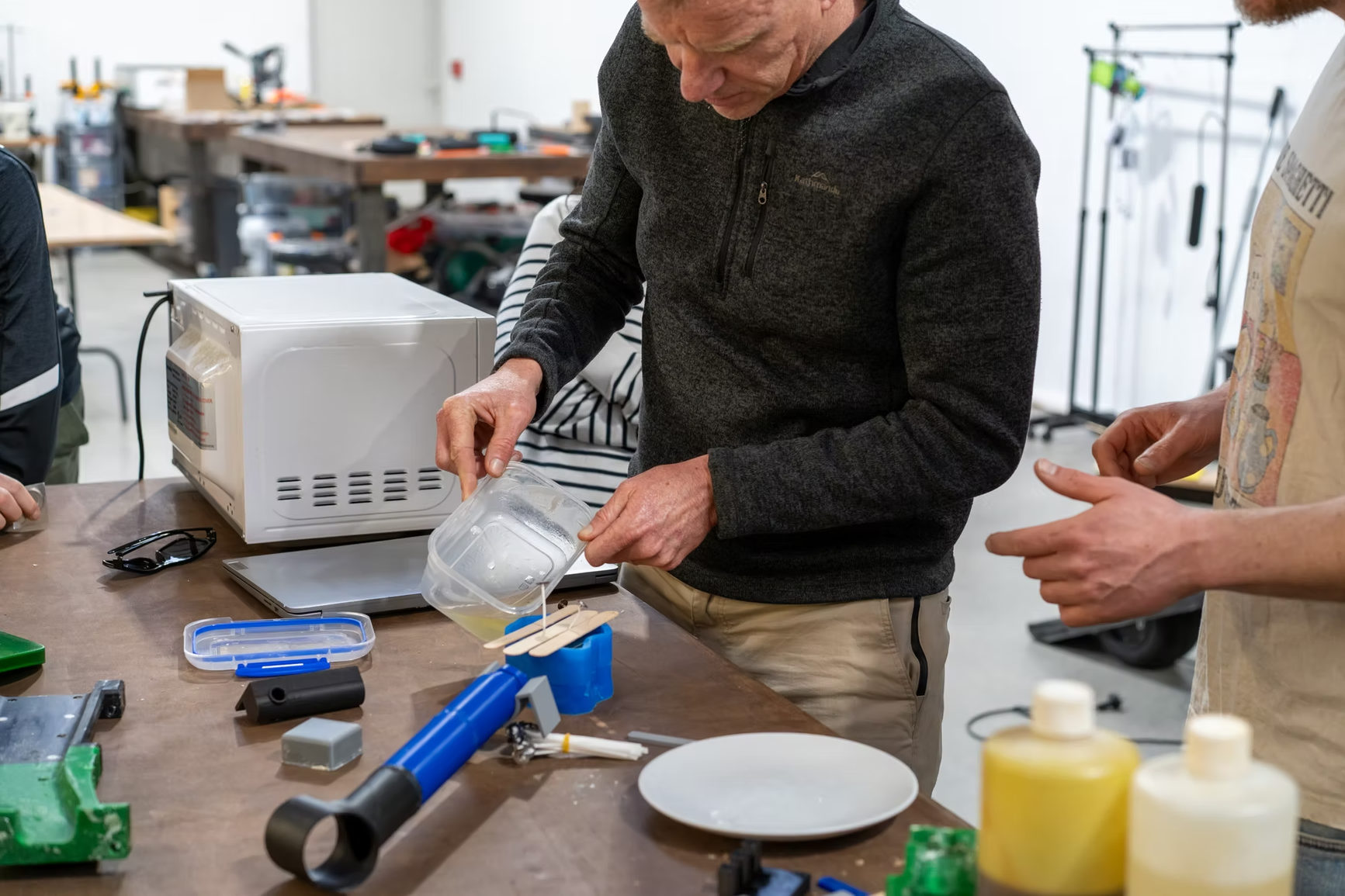 Jeremy pouring wax into a 3D printed mould during an in-school professional development workshop