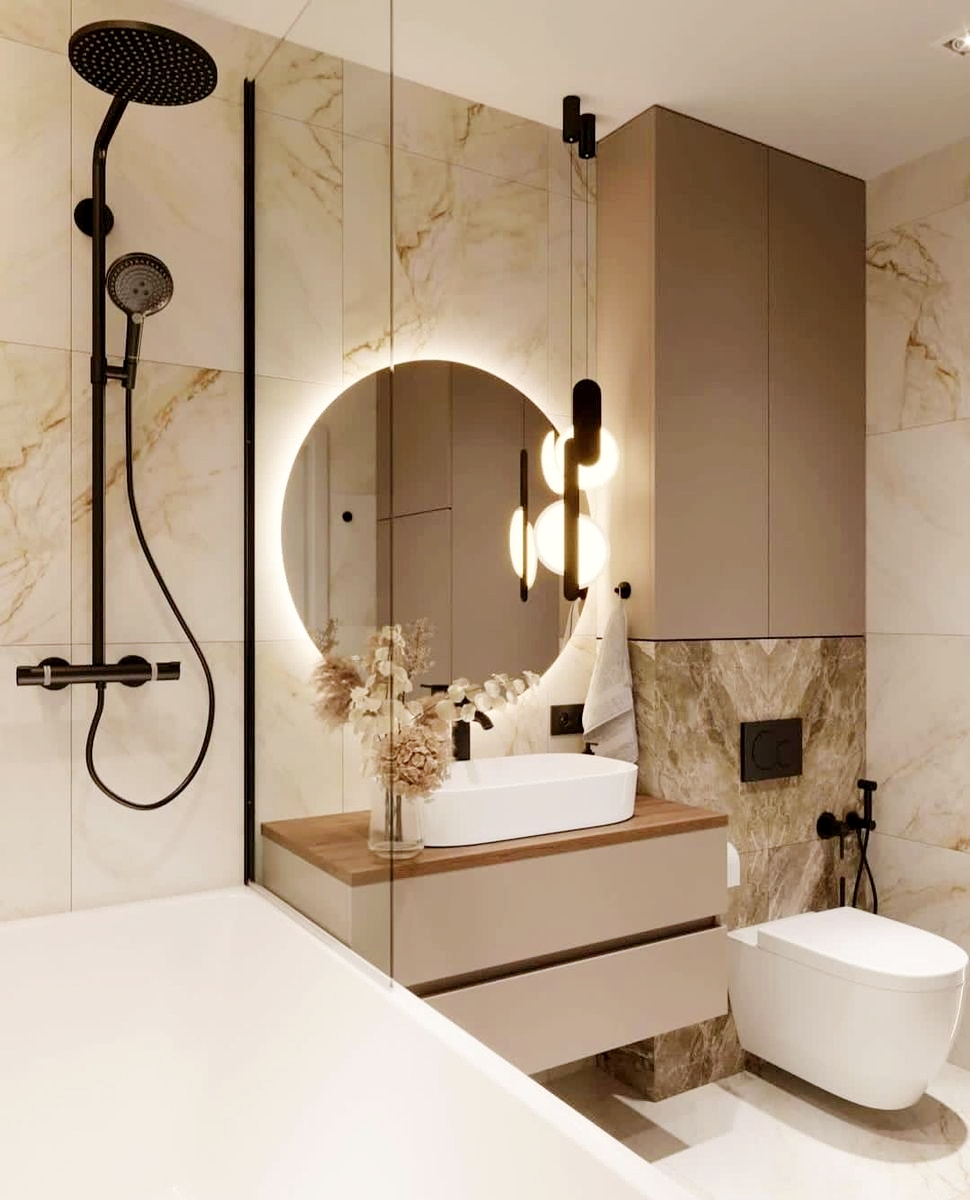 Luxury marble bathroom with double rainfall showerhead, integrated niche, black fixtures, LED-lit round mirror