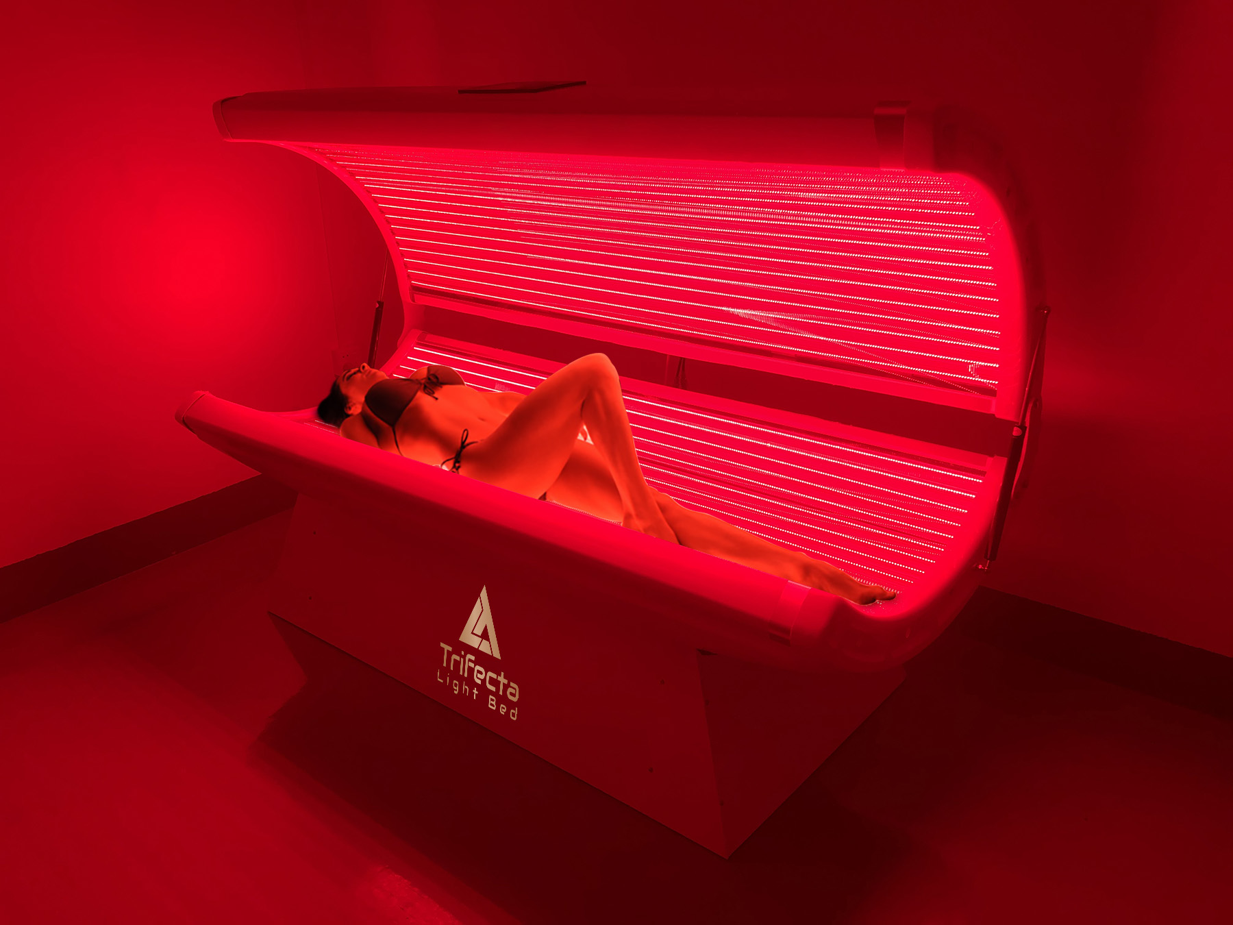 Trifecta Red Light Therapy bed open with patient inside