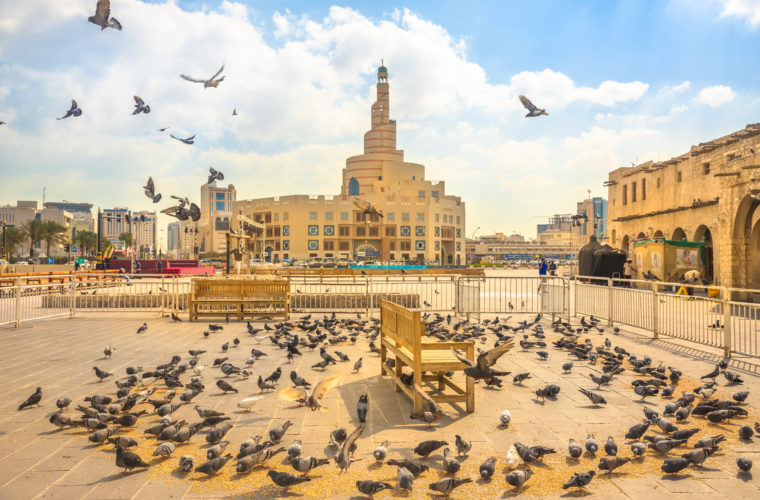 Fanar Qatar Islamic Cultural Center with pigeons in the foreground