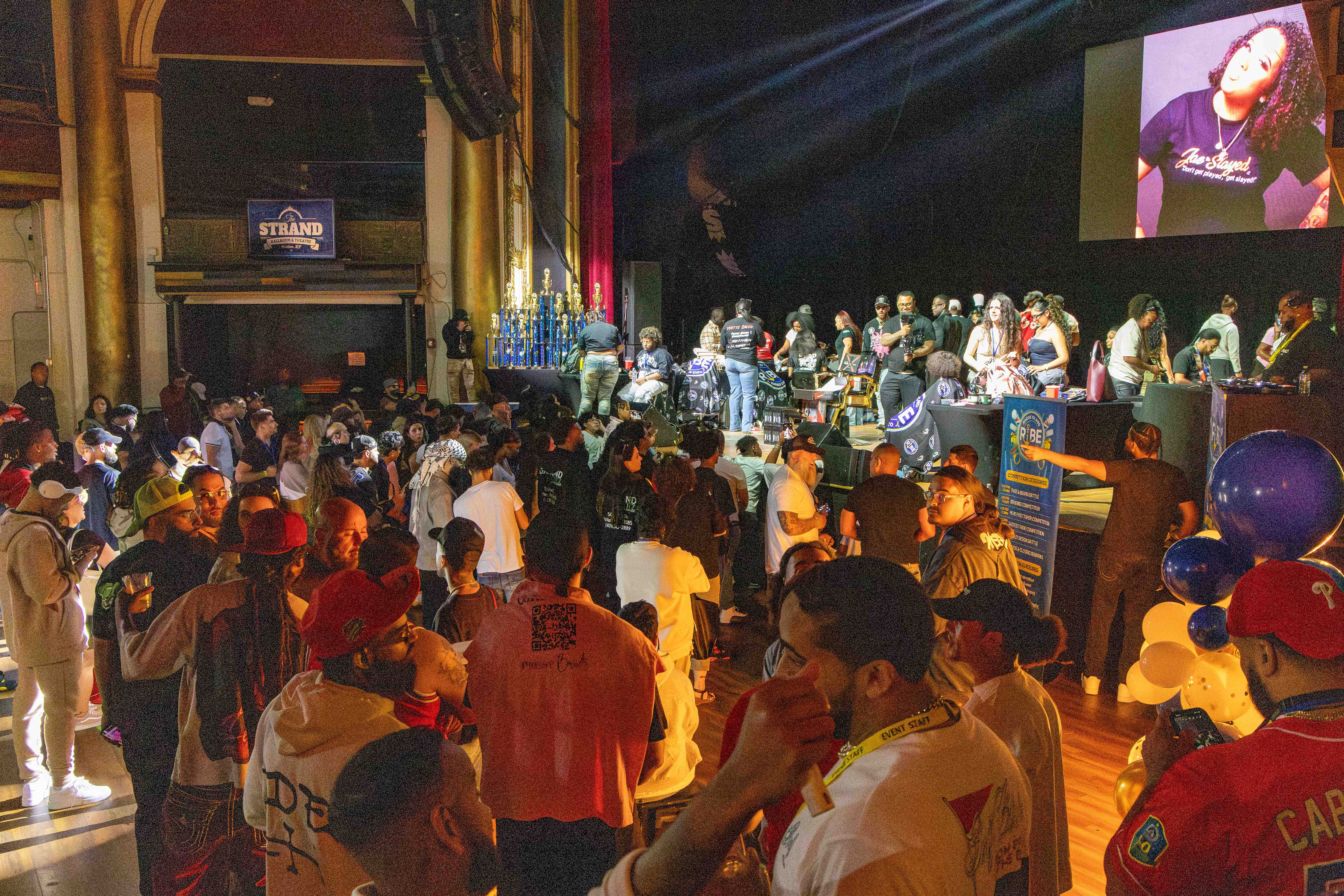 Busy expo floor with vendors and attendees