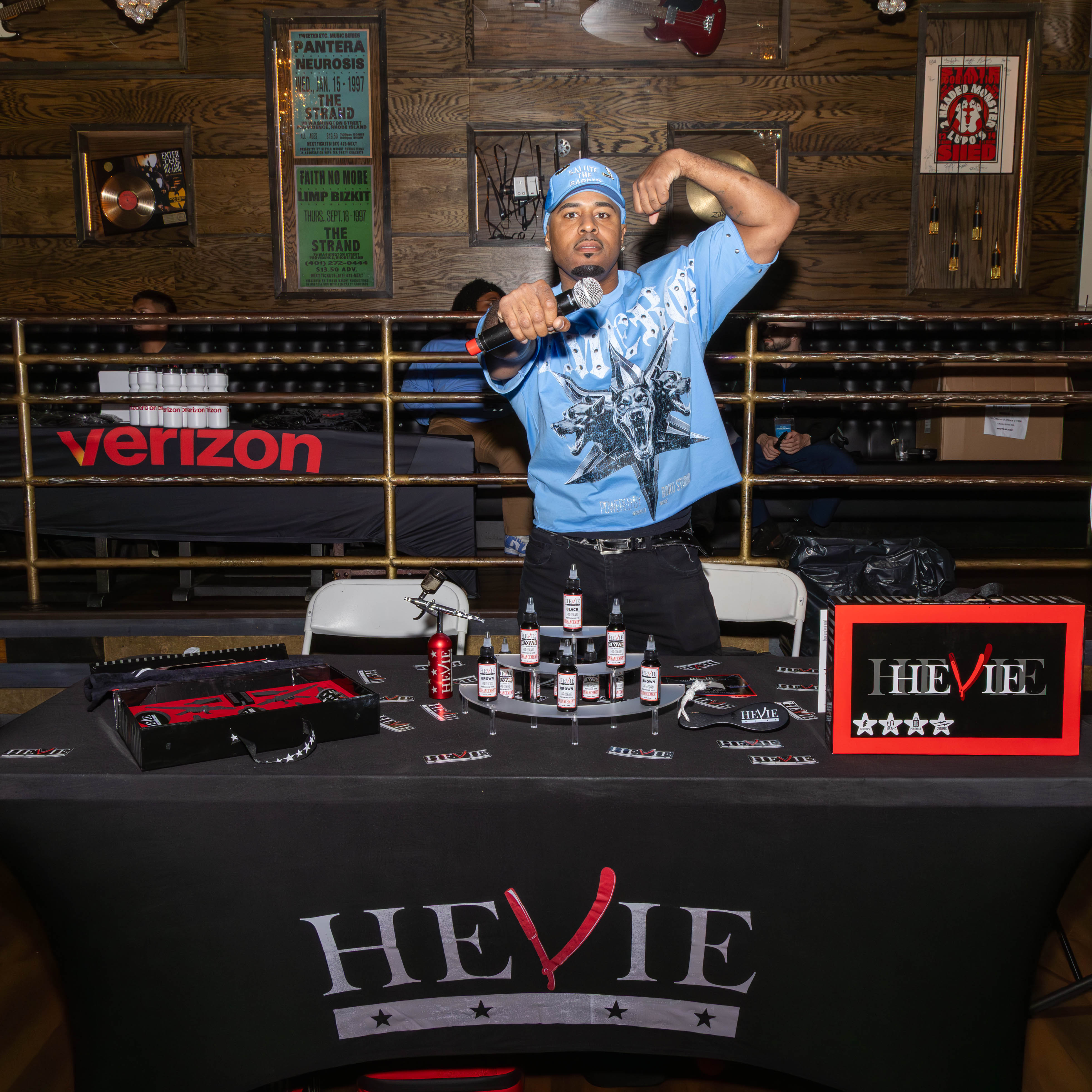 Vendor demonstrating products at HEVIE booth
