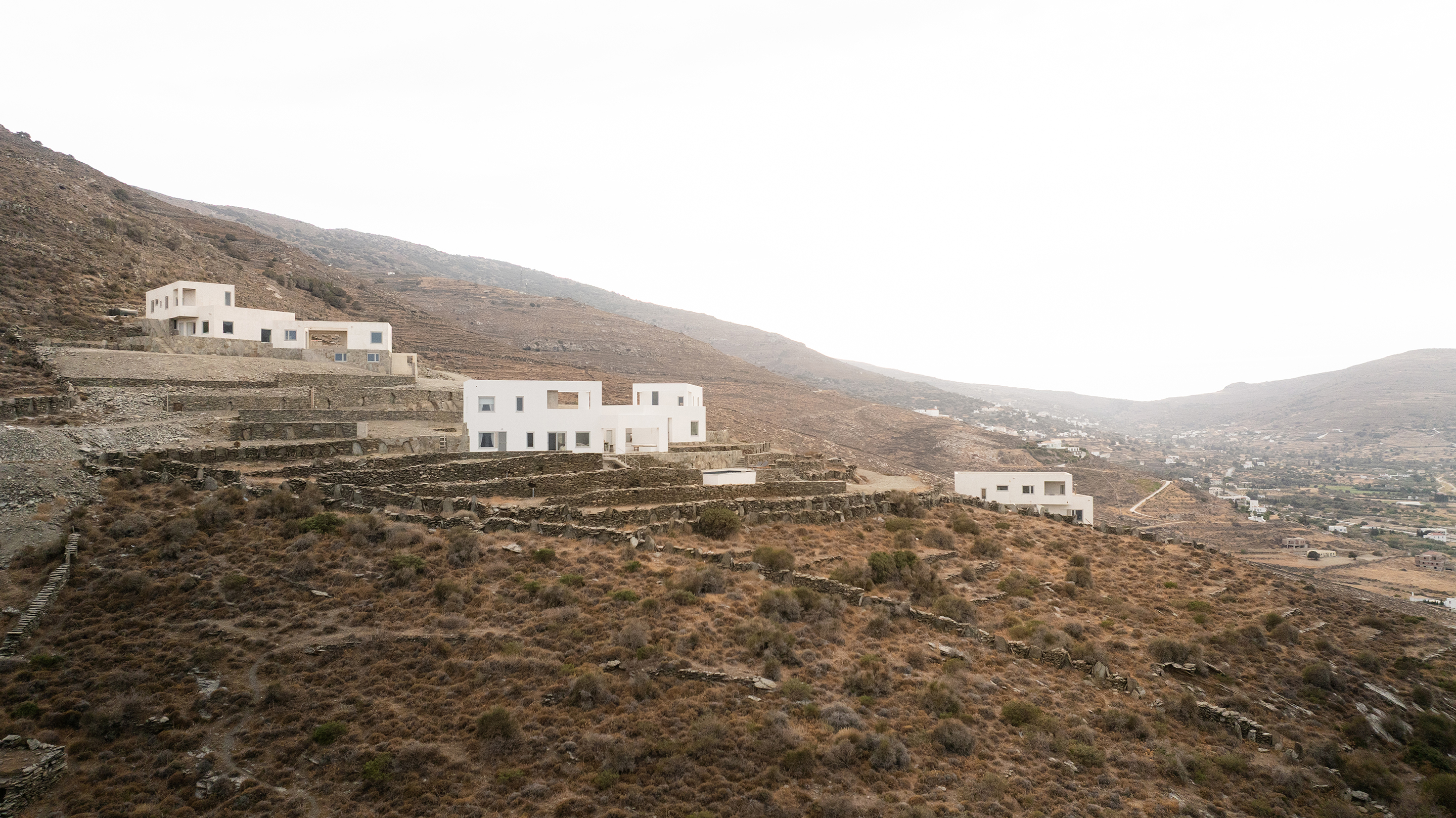 Wide landscape with multiple houses on terraced hillside