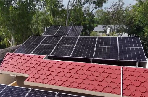 Close-up of solar panels installed on a red clay-tile residential roof, a real Solarise installation