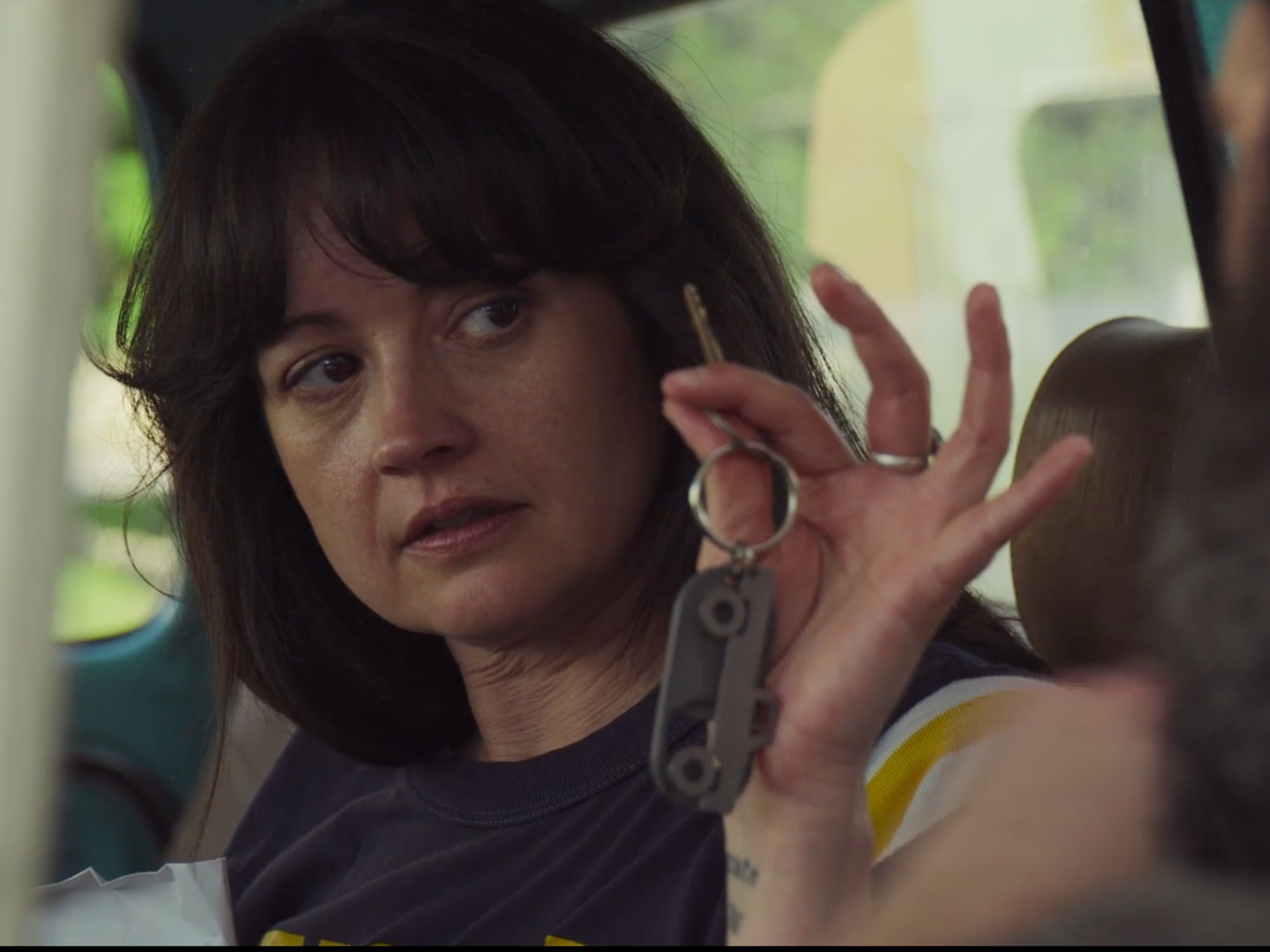 Dee holds up a set of keys