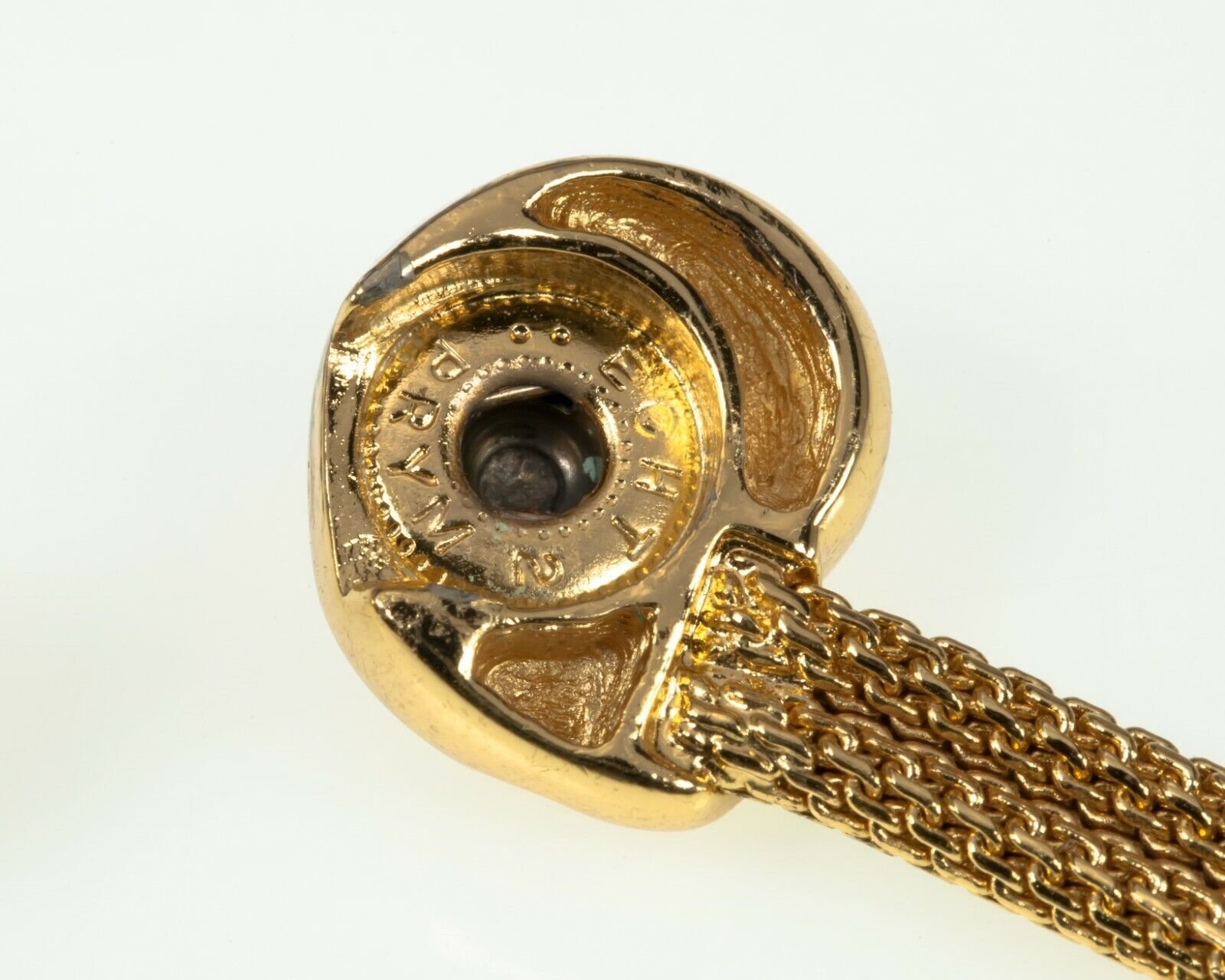 Gold-toned snap clasp with intricate detailing