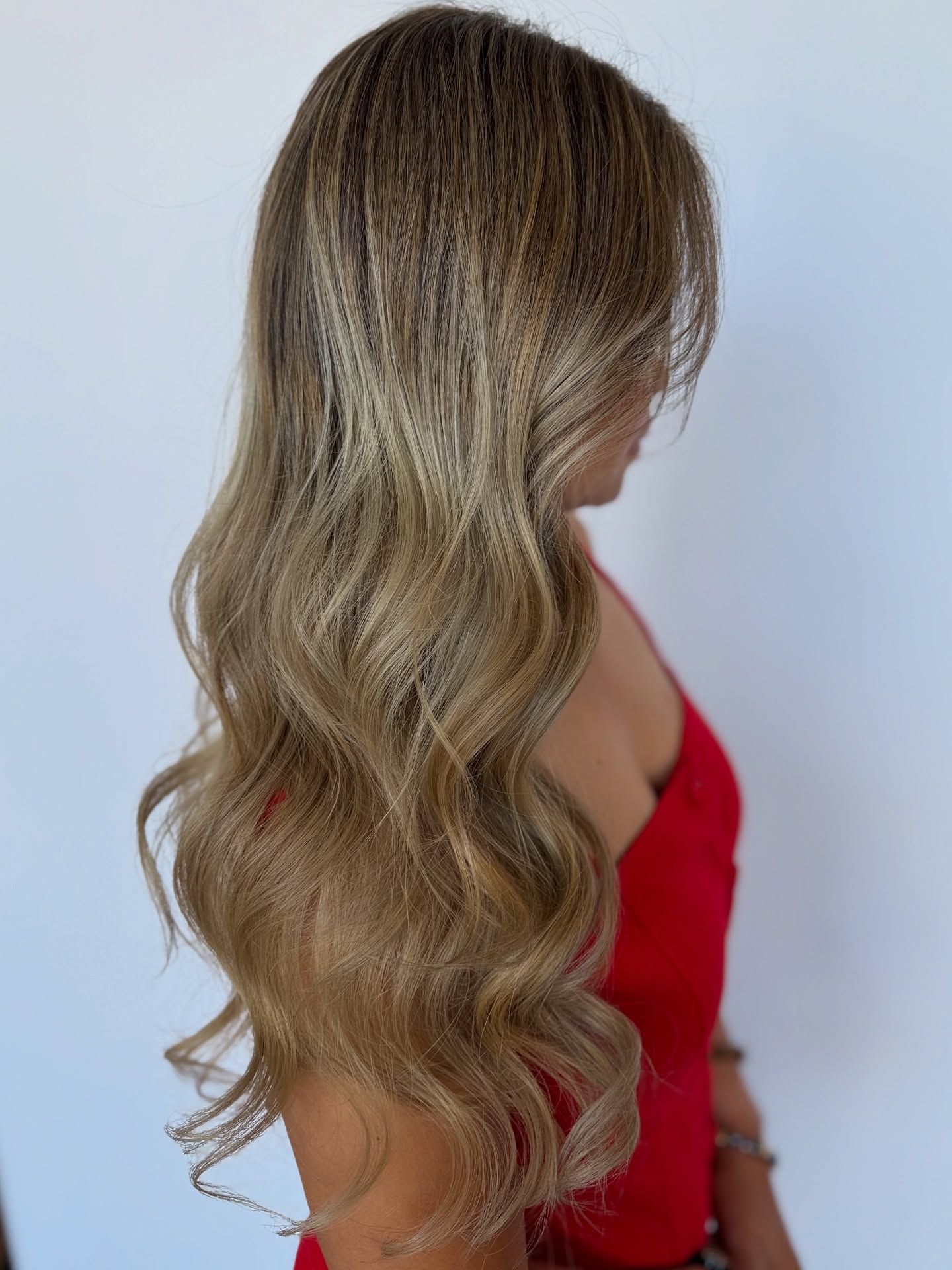 Blonde balayage side profile view — The Hair Co. Salon