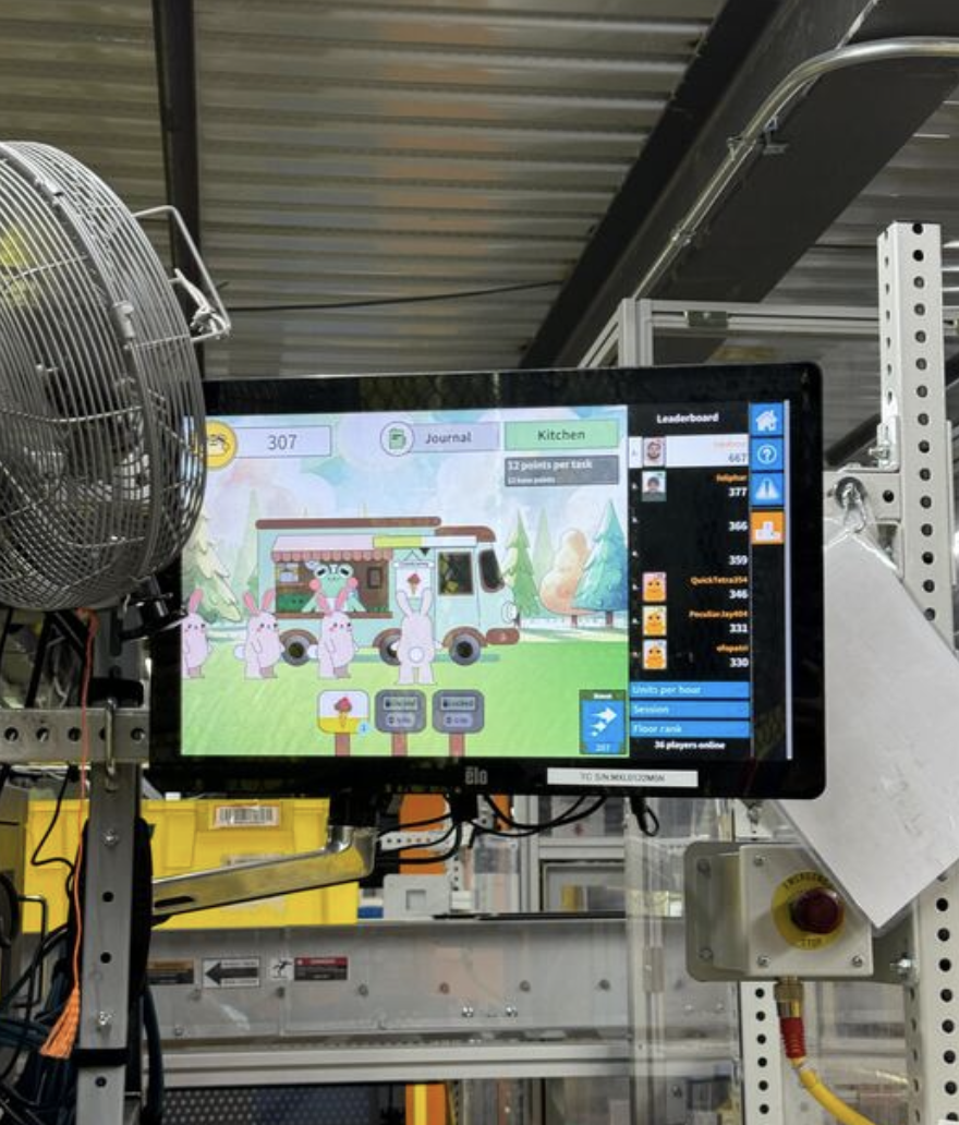 Critter Creamery running on a monitor in an Amazon fulfillment center