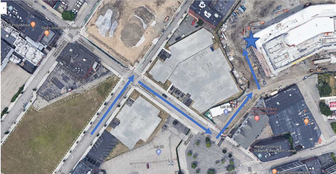 Aerial view showing route to loading dock from Richmond Street, marked with blue arrows