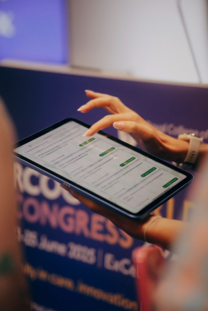 A judge using a tablet to score submissions through InstaJudge at the RCOG Congress, ExCeL London
