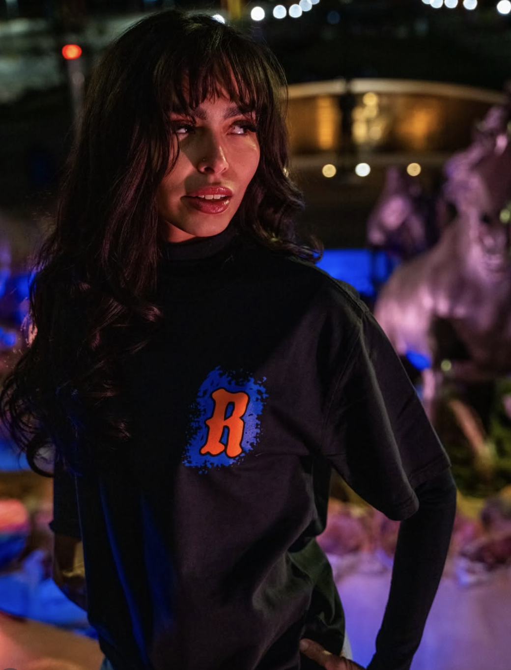 Woman in R logo shirt