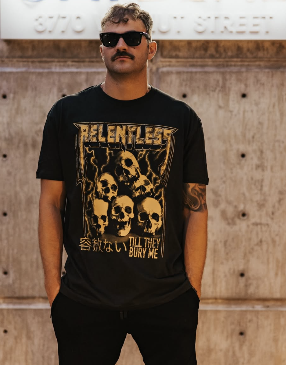 Man in Relentless skull tee