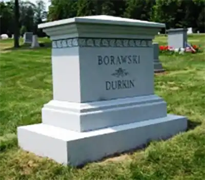 Tan granite with floral side carving