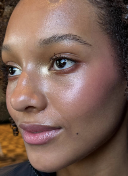 Radiant makeup artistry - glowing skin with golden highlight