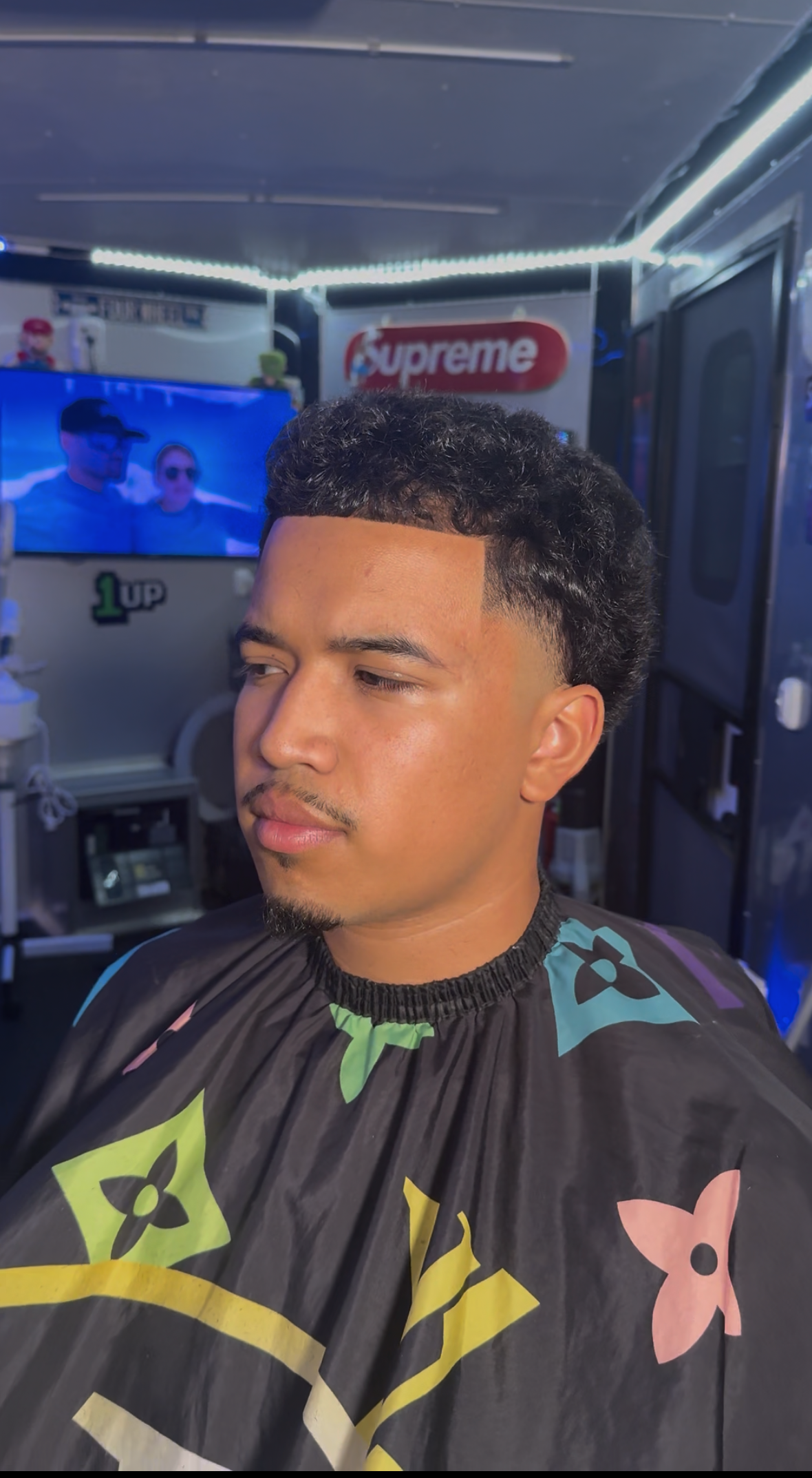 Curly top fade in mobile trailer