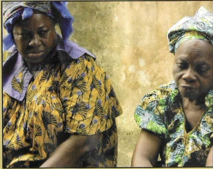 Two elderly widows during the outreach gathering