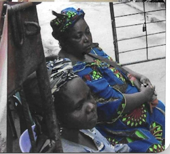 A mother cradles her child during the community visitation
