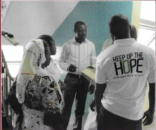 Volunteers in Keep Up The Hope shirts on hospital stairwell