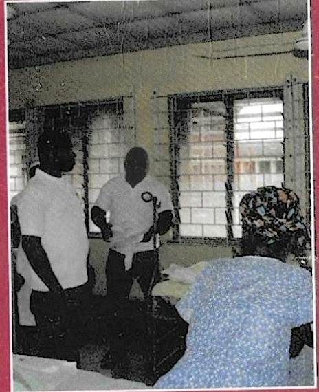 Team members comforting patient in ward