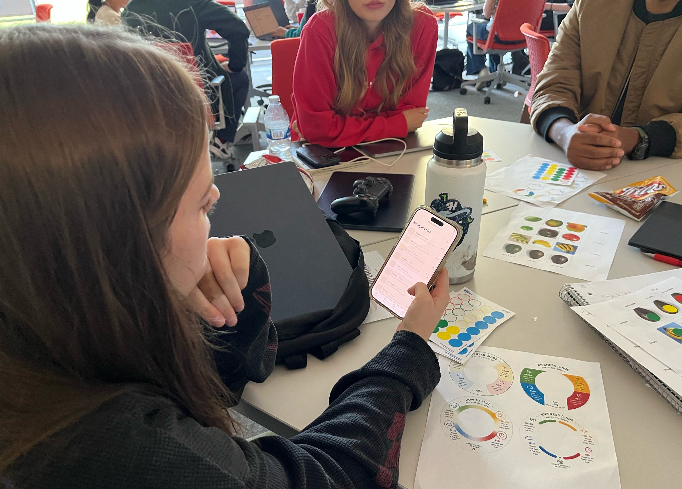 Participant reviewing the Pantri shopping list on a phone during a testing session