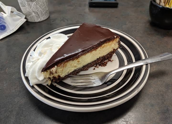 Chocolate cheesecake with whipped cream
