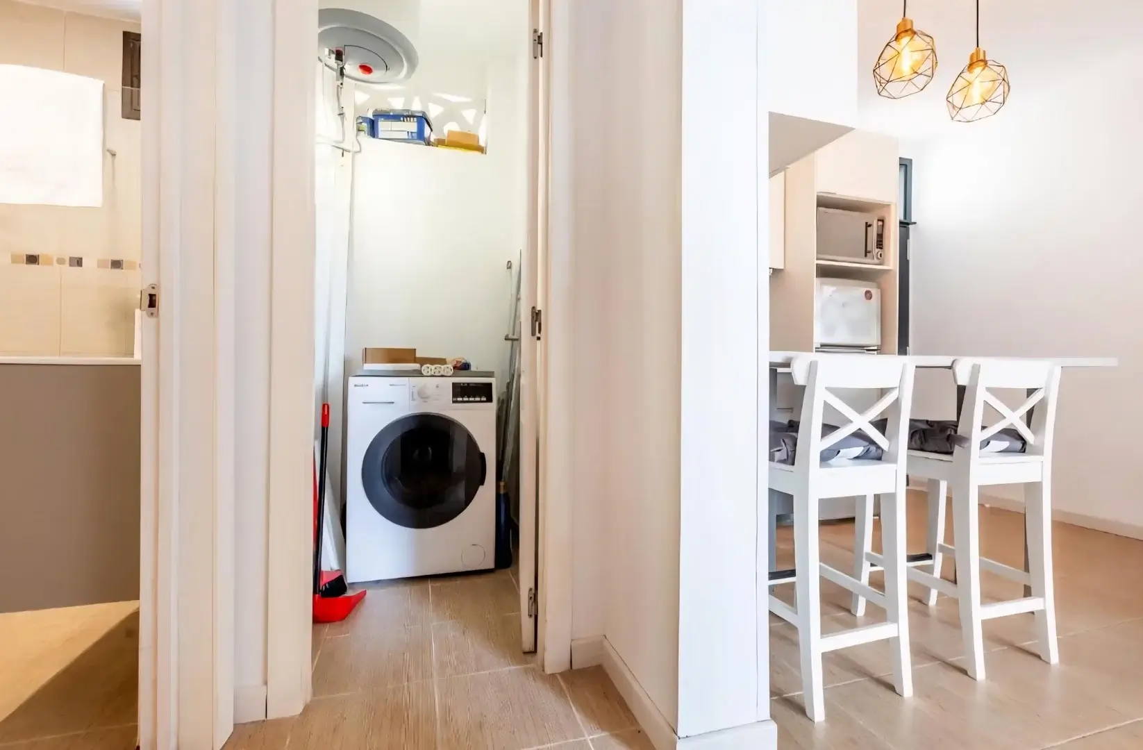 Utility area with washing machine and kitchen