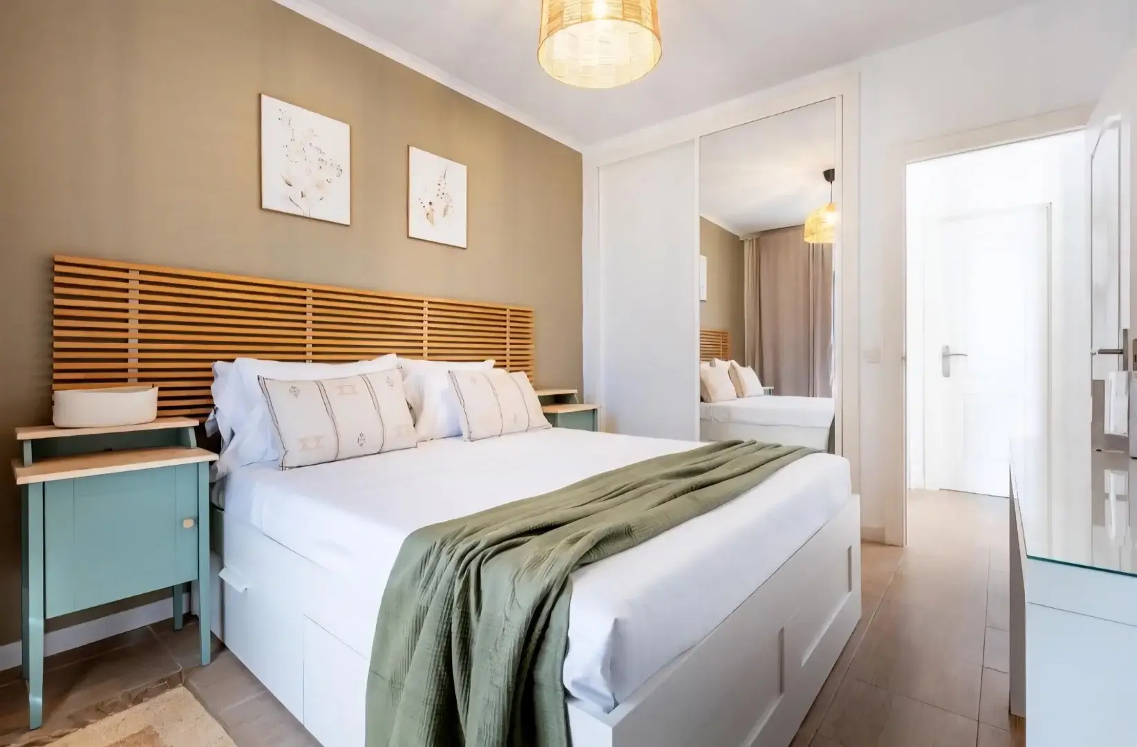 Cozy bedroom at Las Piteras 110 with wooden headboard and natural light