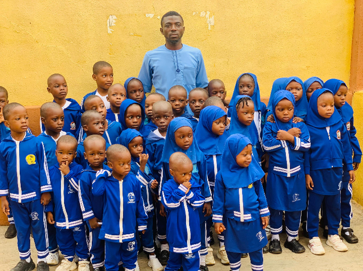 Al-Azeez Model School students and teacher