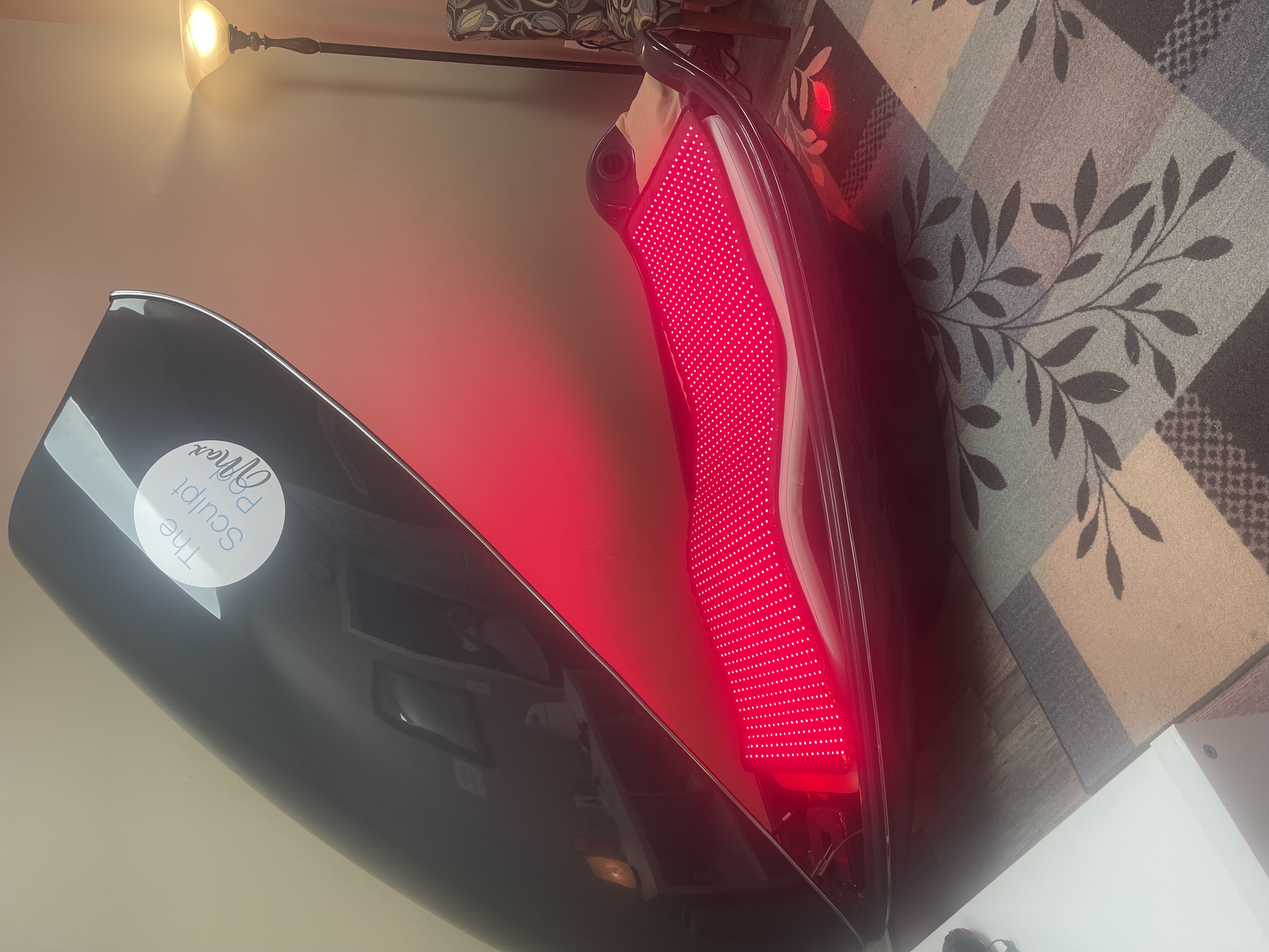 The Sculpt Pod with branded display and red light therapy technology