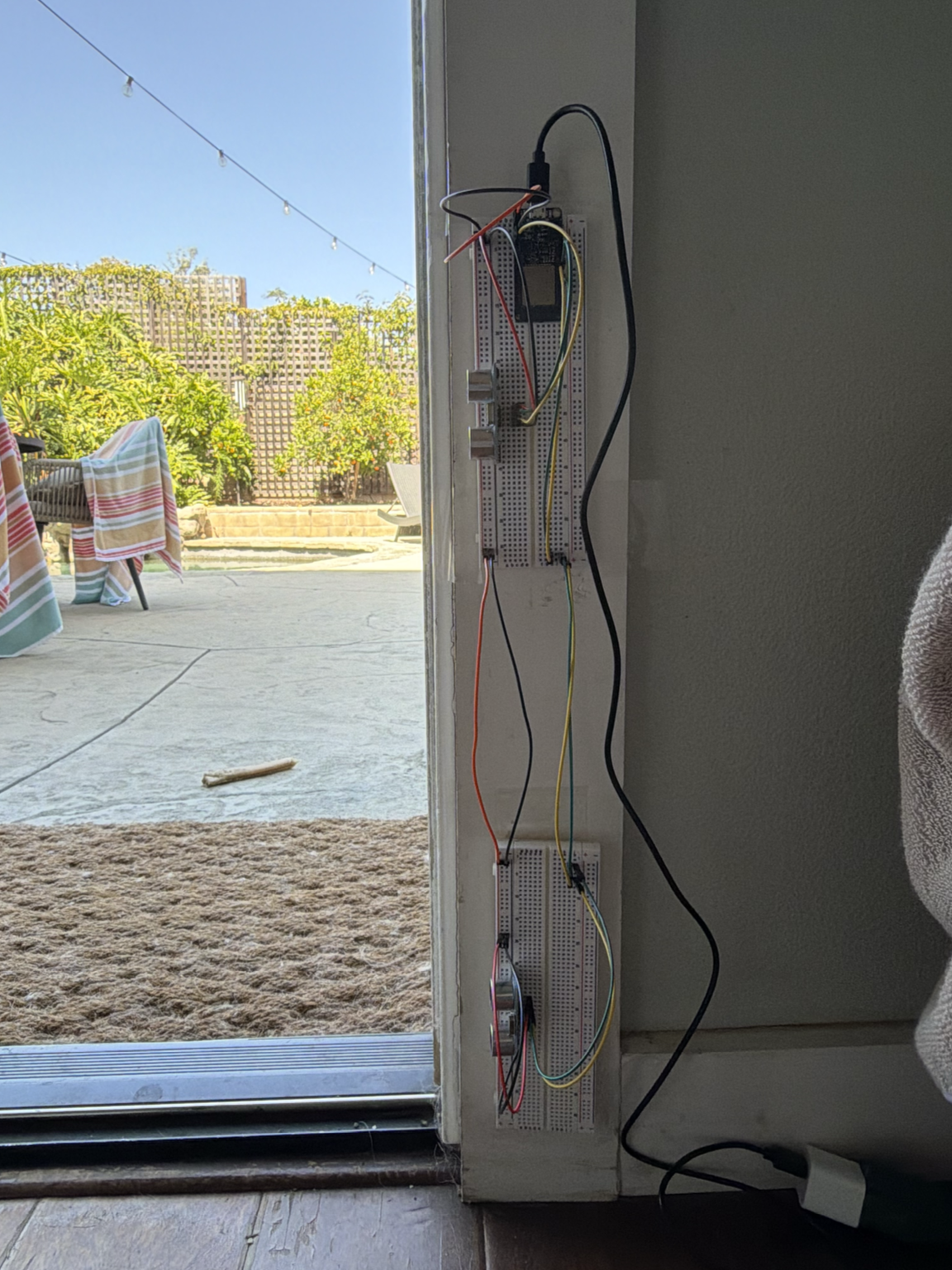 Both sensors mounted along the sliding glass door frame