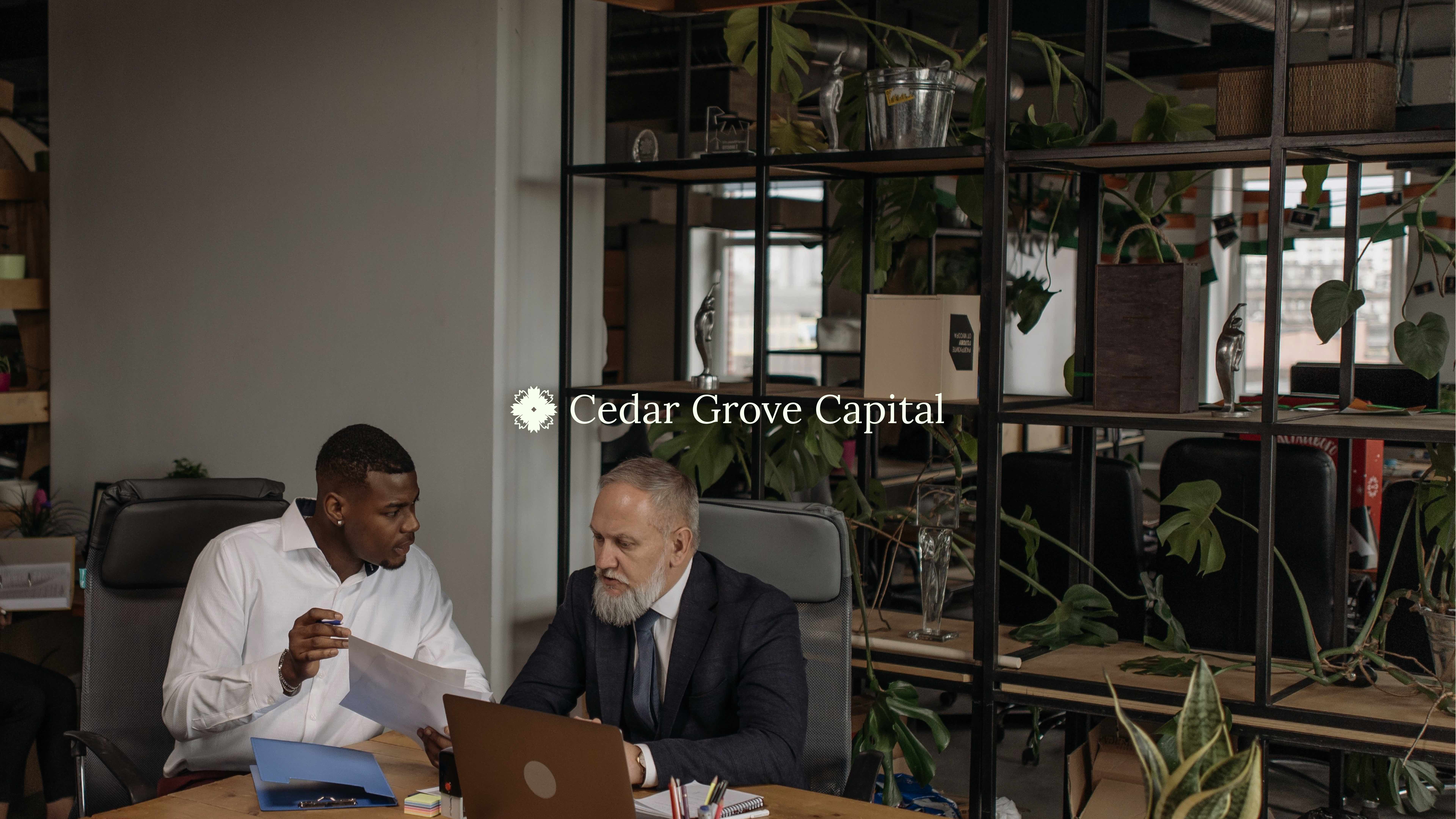 Cedar Grove Capital logo over office meeting