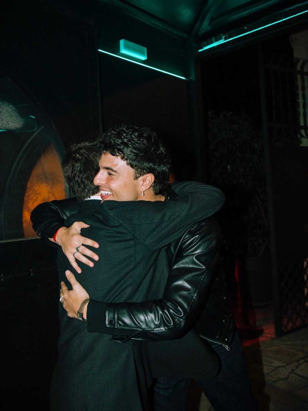 Two BENOW members embracing at a community evening