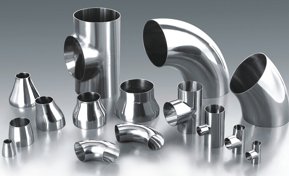 Comprehensive collection of stainless steel fittings including unions, elbows, tees, and reducers
