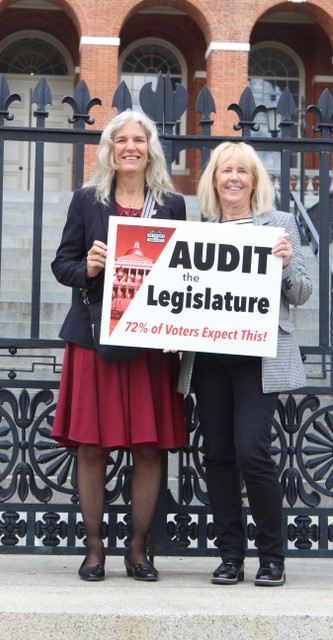 Karla Miller at State House rally holding Audit the Legislature sign