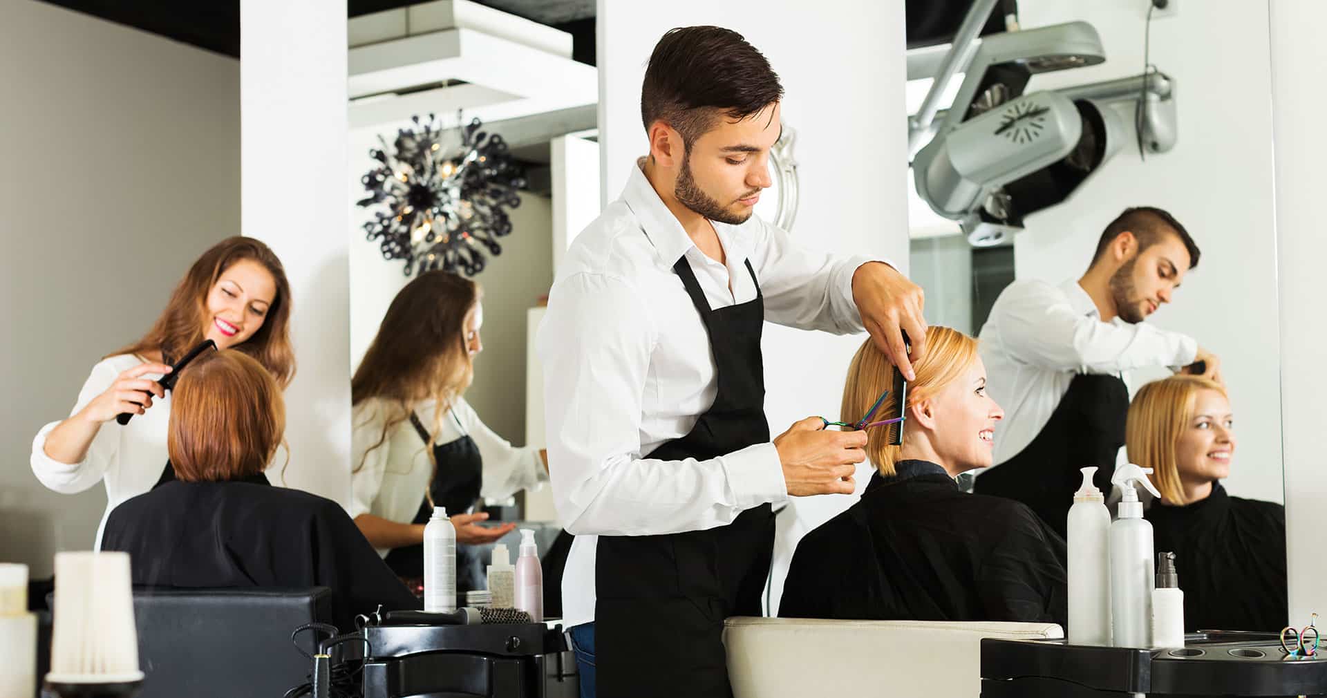 Salon stylists working with clients