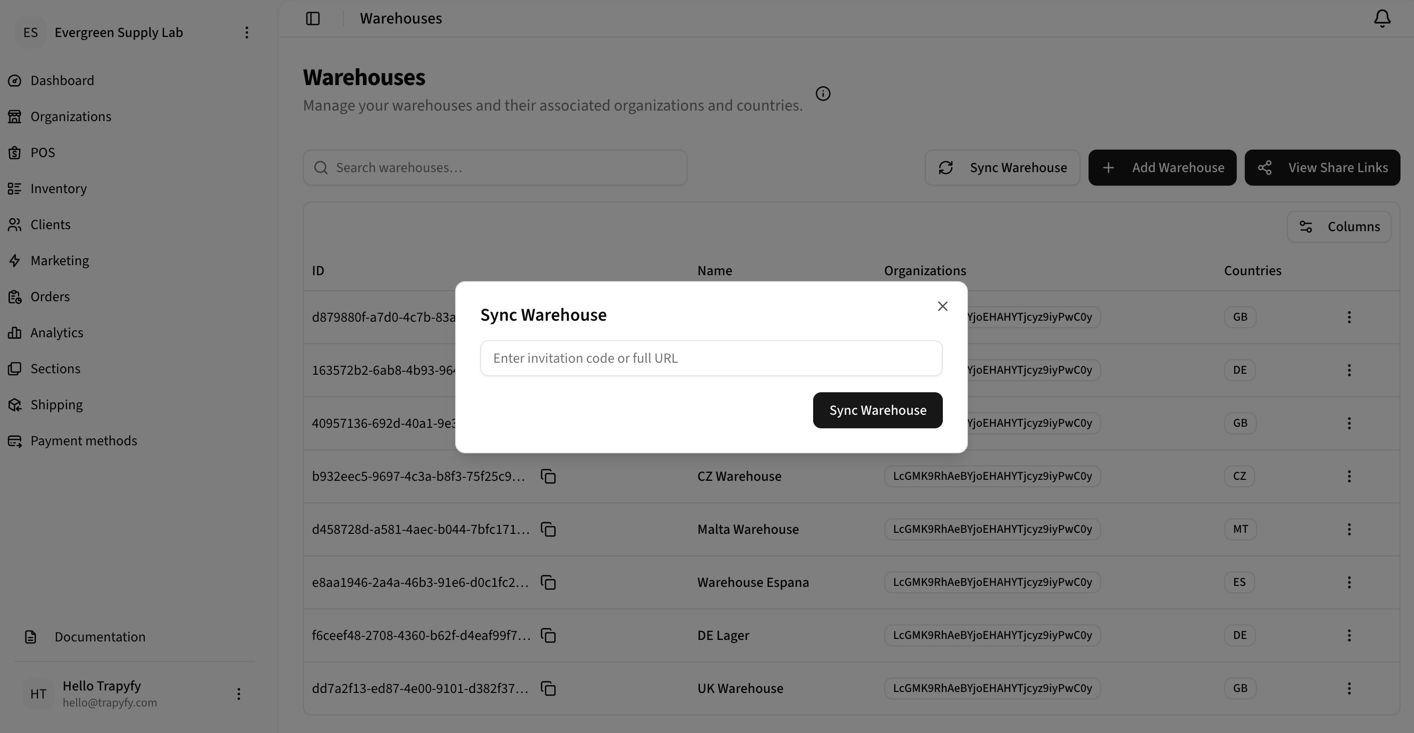 Warehouses list with the Sync Warehouse modal open, showing an input field labeled Enter invitation code or full URL and a Sync Warehouse button