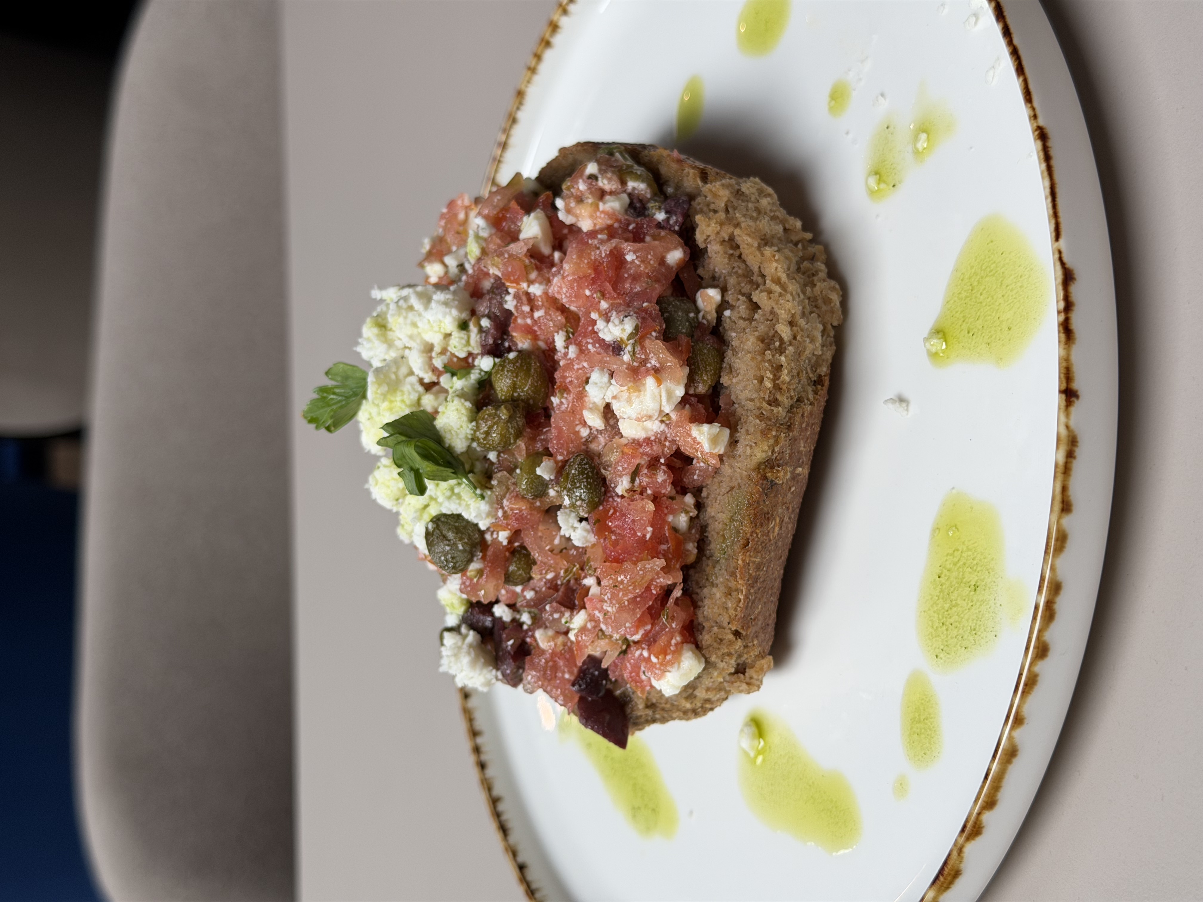 Greek dakos with grated tomato, feta and capers