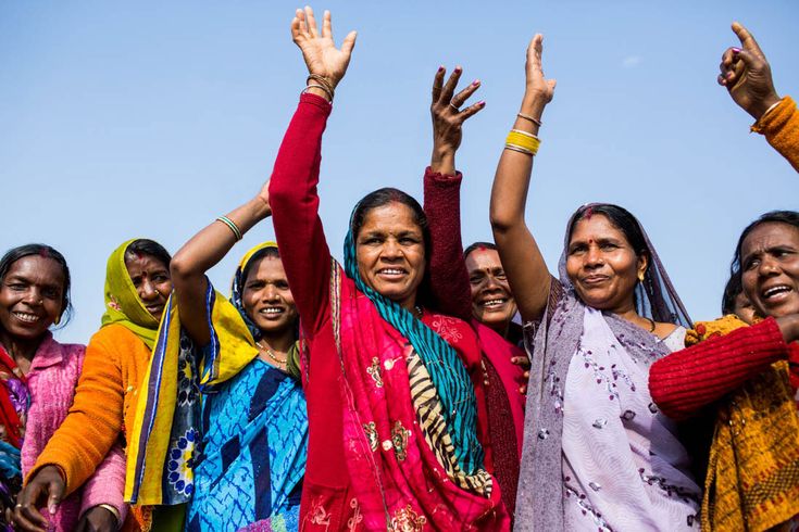 Women from a community standing together