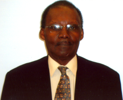 Tommy Gregg, Marine Corps veteran, in a dark suit and patterned tie