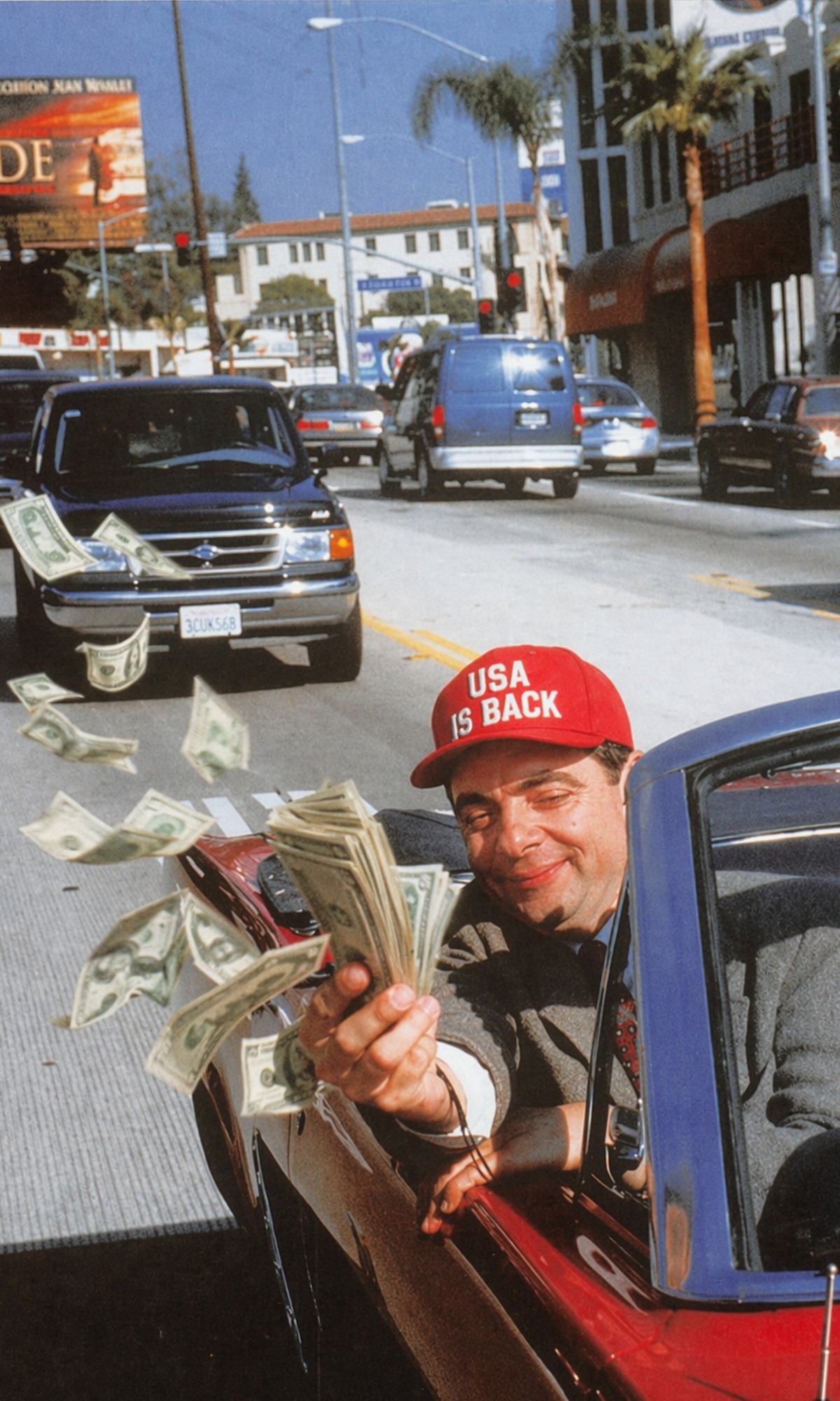 Man in car throwing money, USA IS BACK movement