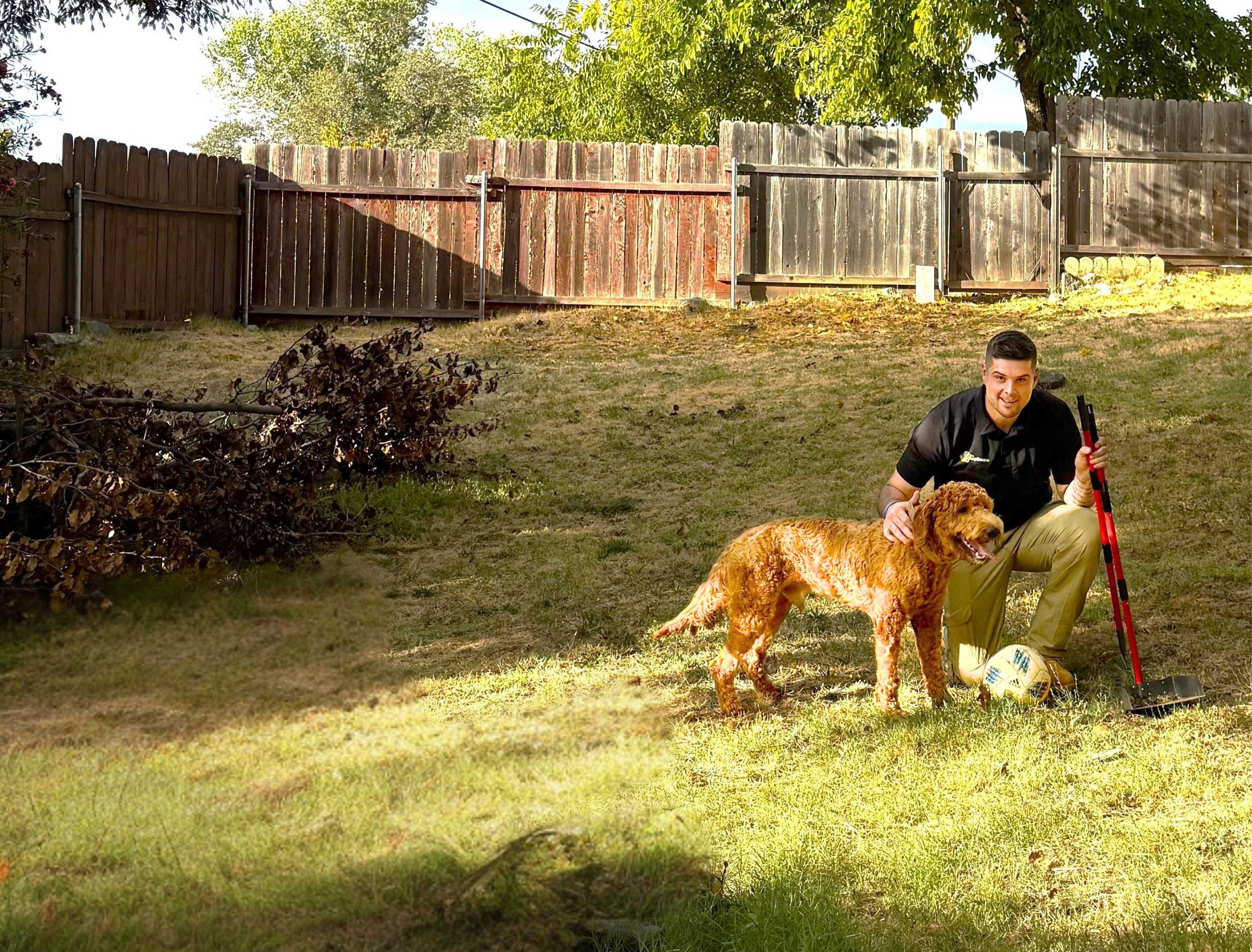 A service professional and dog in a backyard