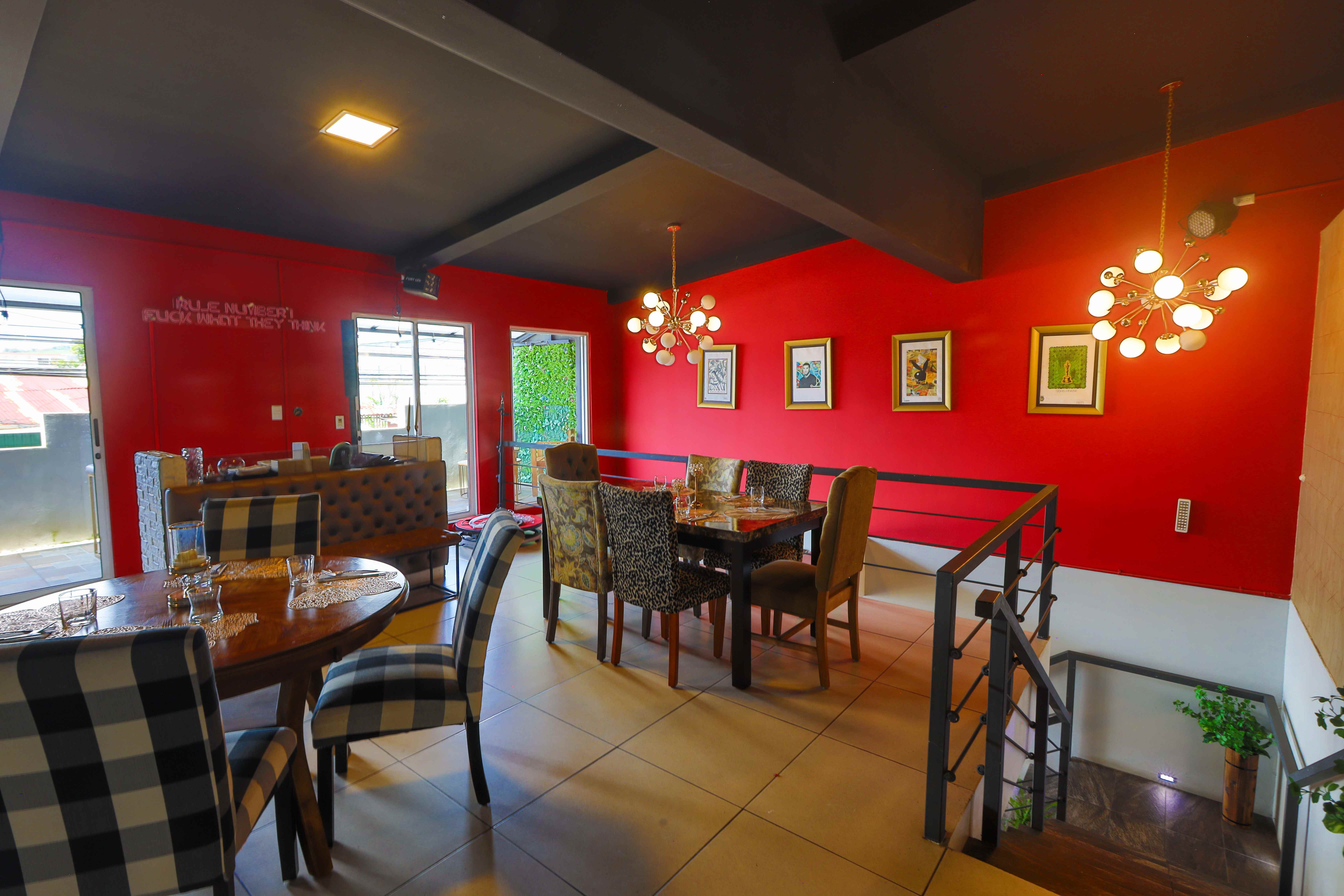 Hollywood House upstairs dining room with red walls