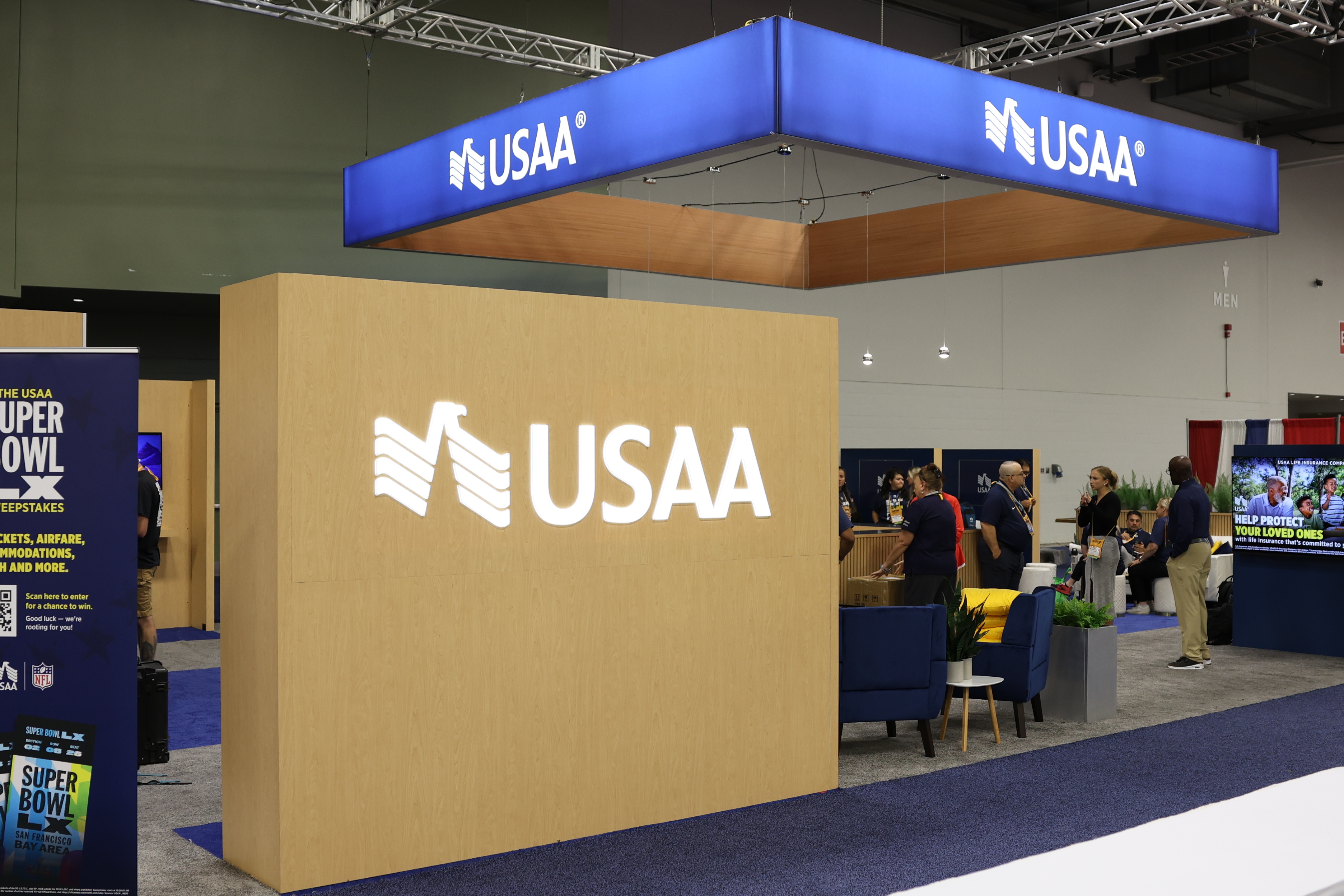 USAA corporate booth at VFW convention with illuminated signage and lounge seating