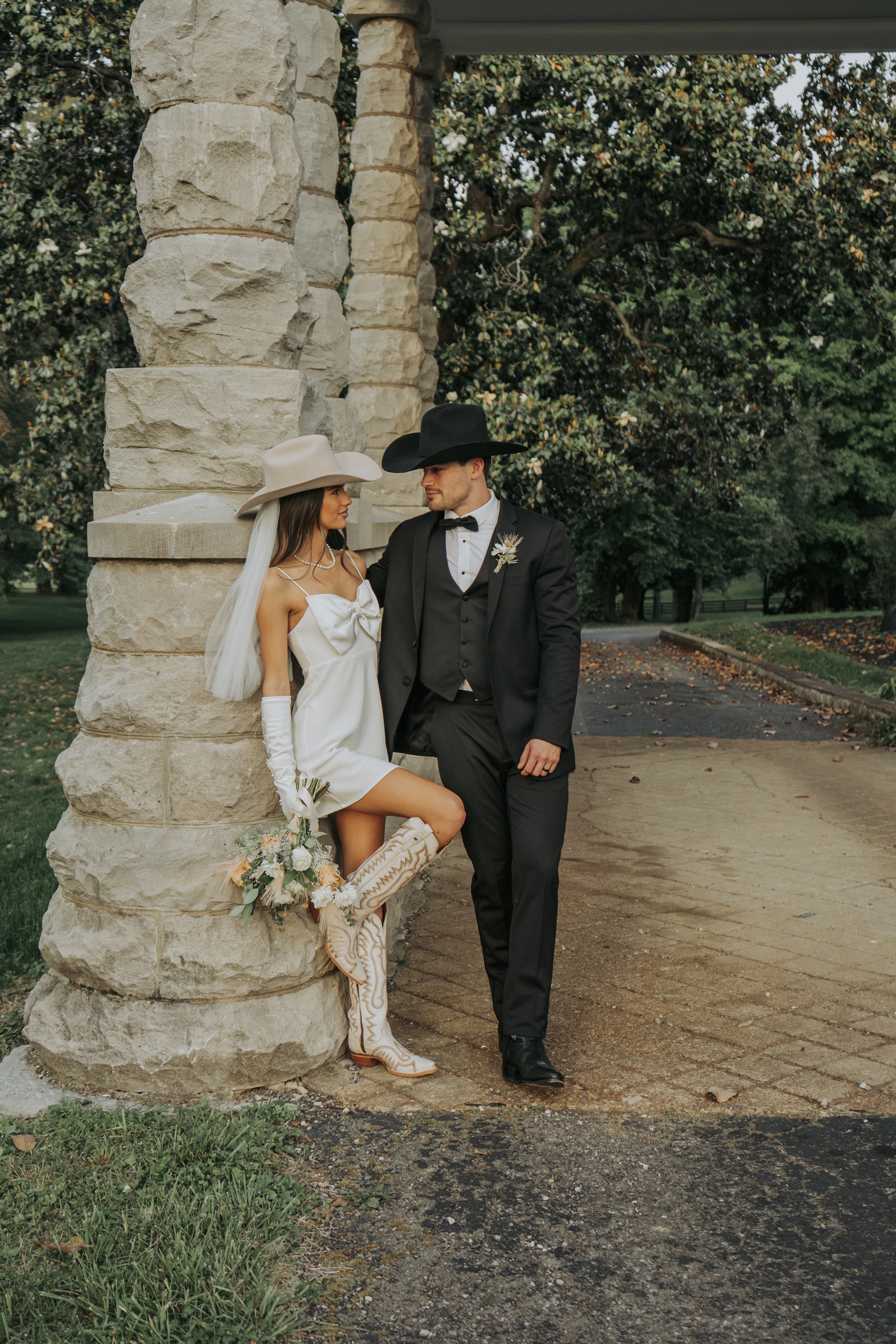 Bridal couple intimate portrait with boots visible