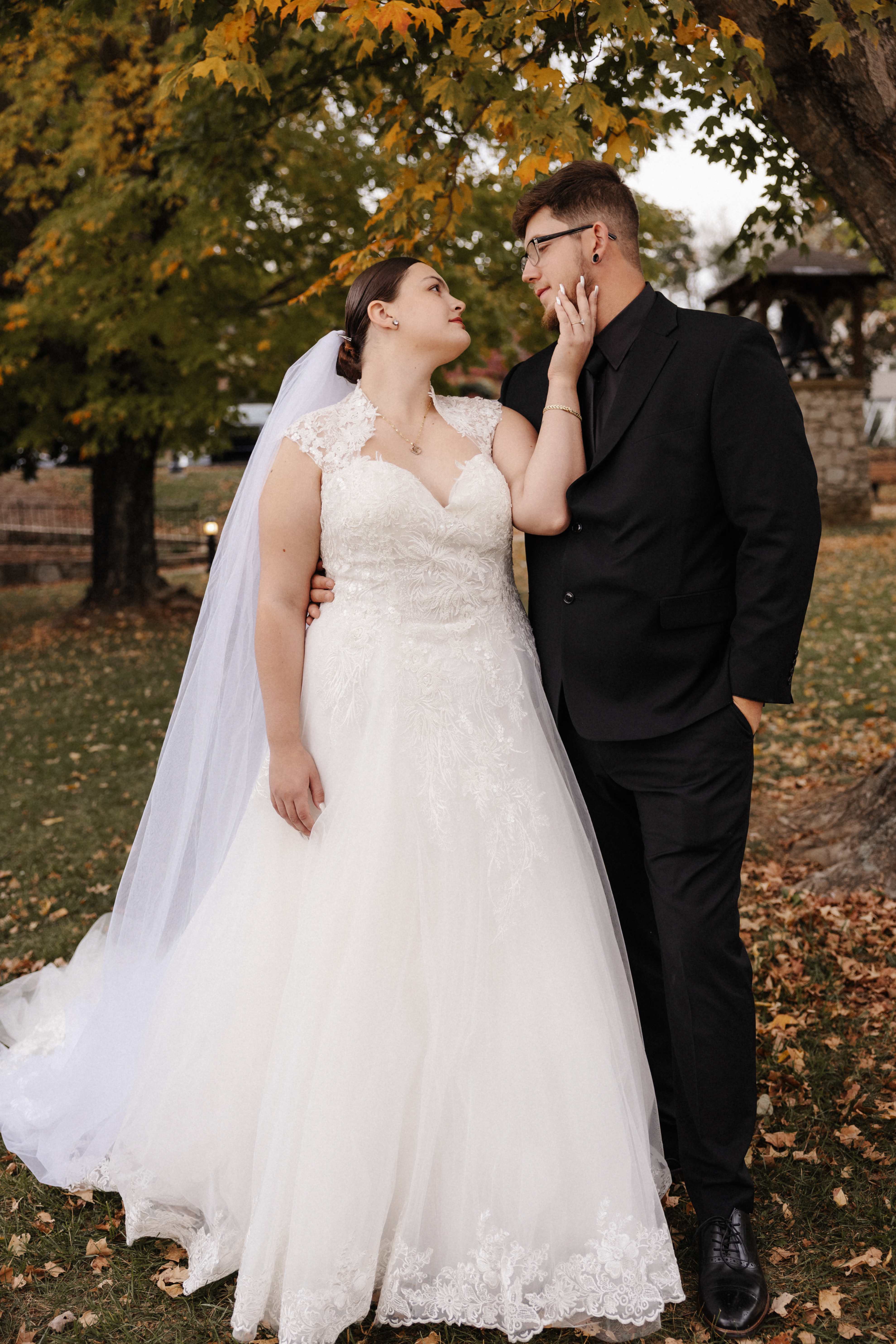 Romantic couple portrait with bride touching groom's face