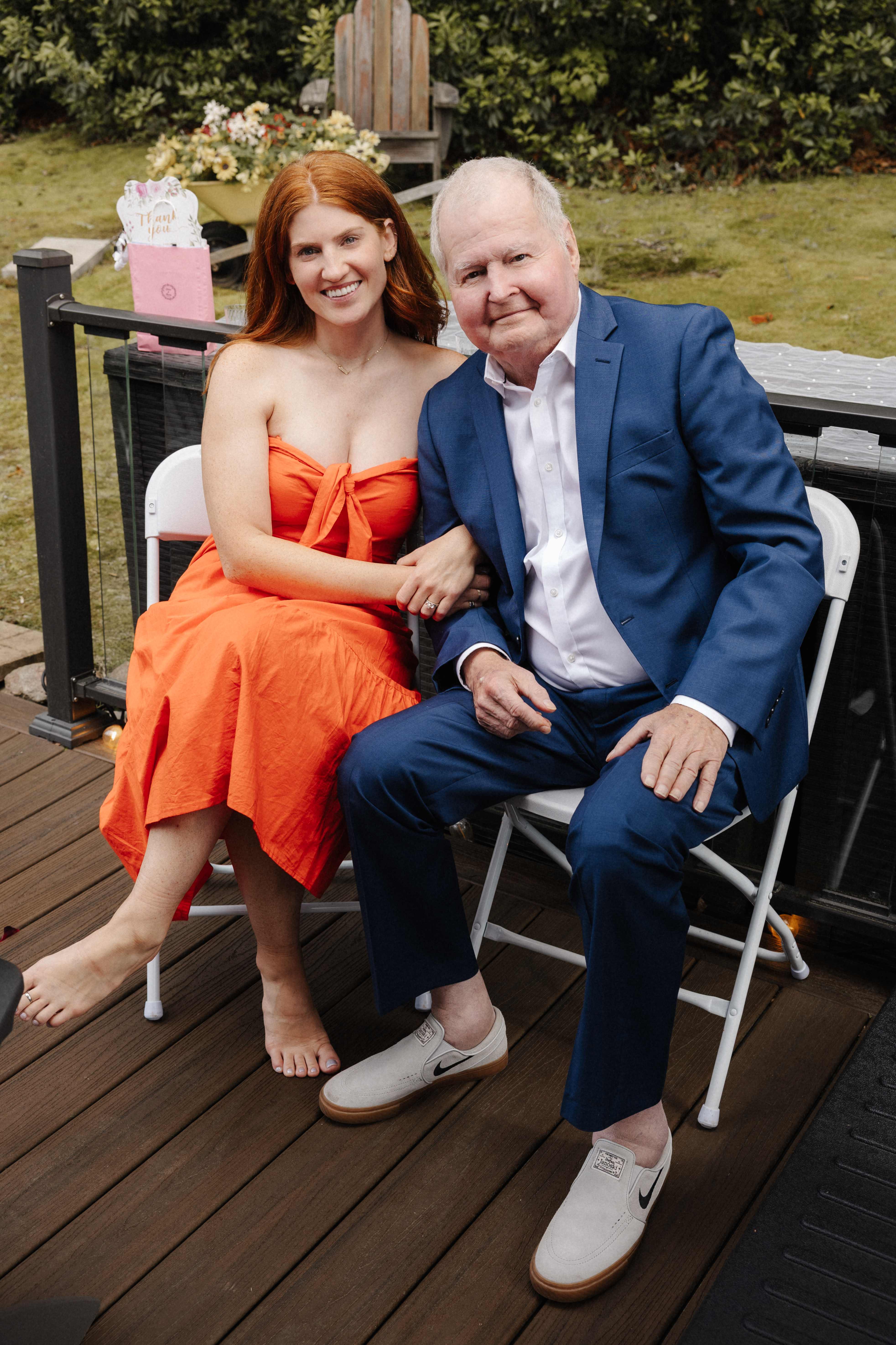 Father and daughter seated portrait at reception