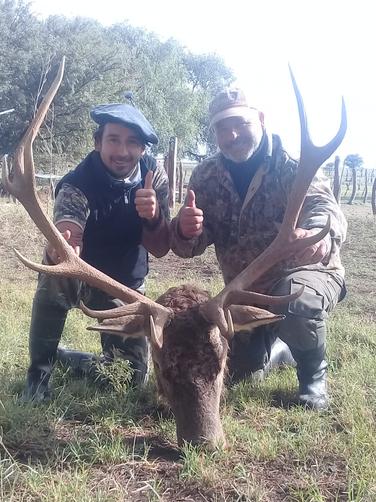 Guided hunting experience at Valle Daza - Hunters celebrating successful deer hunt