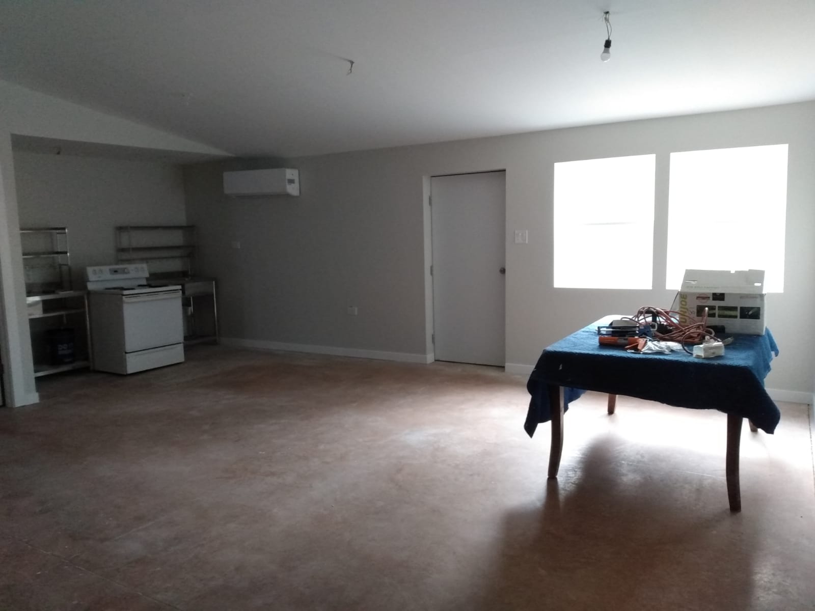 Large room with kitchen area