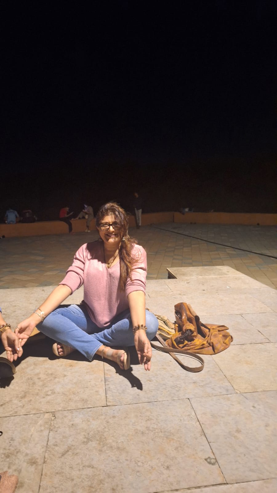 Deepshikha sitting peacefully outdoors in the evening