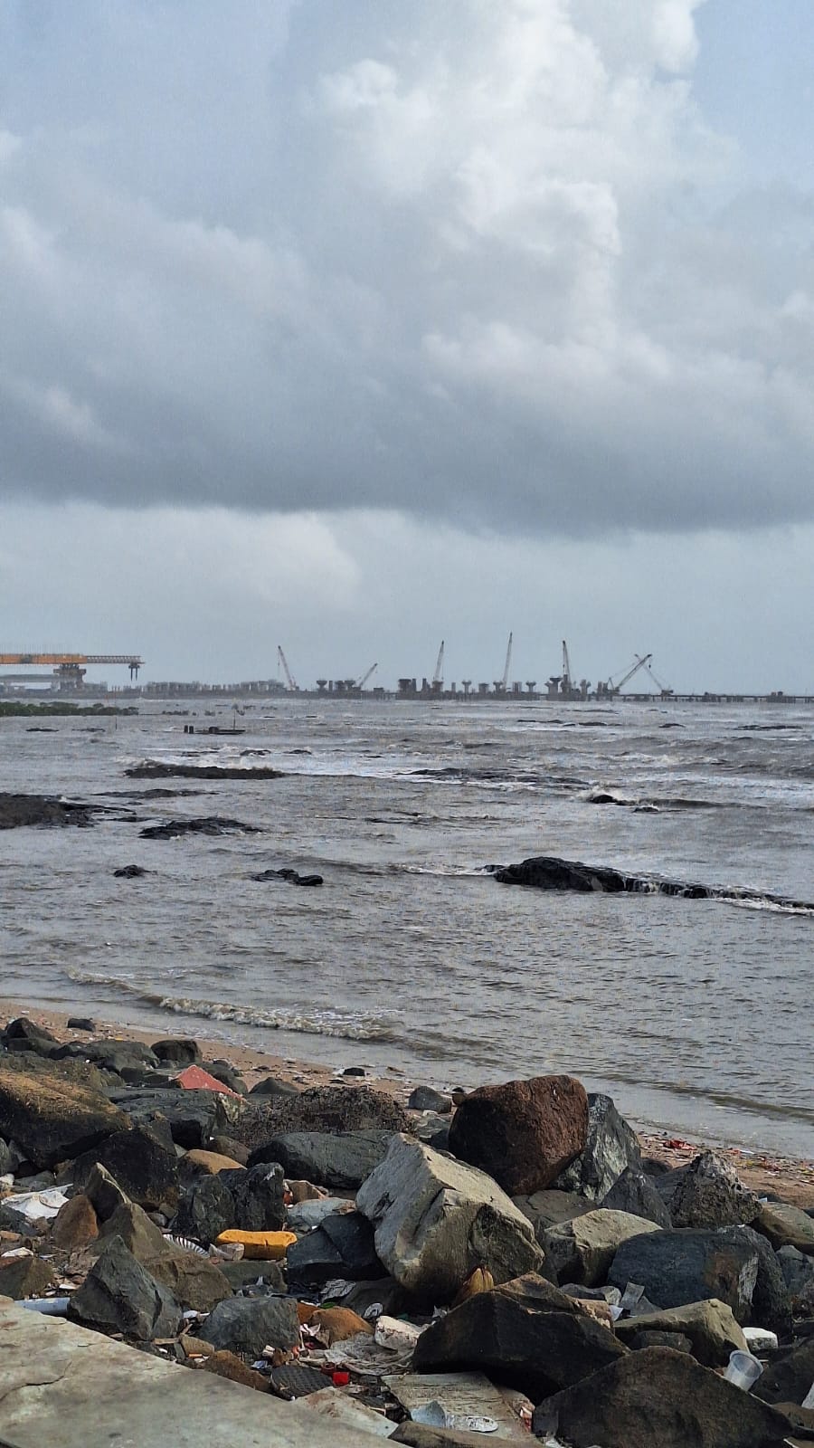 Serene coastal landscape with waves and cloudy sky